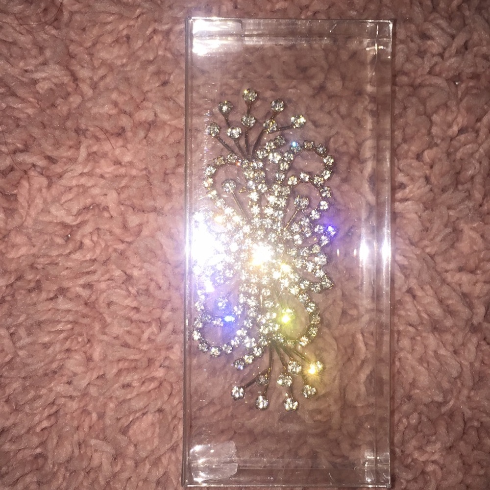 Clothing pin with jewels.